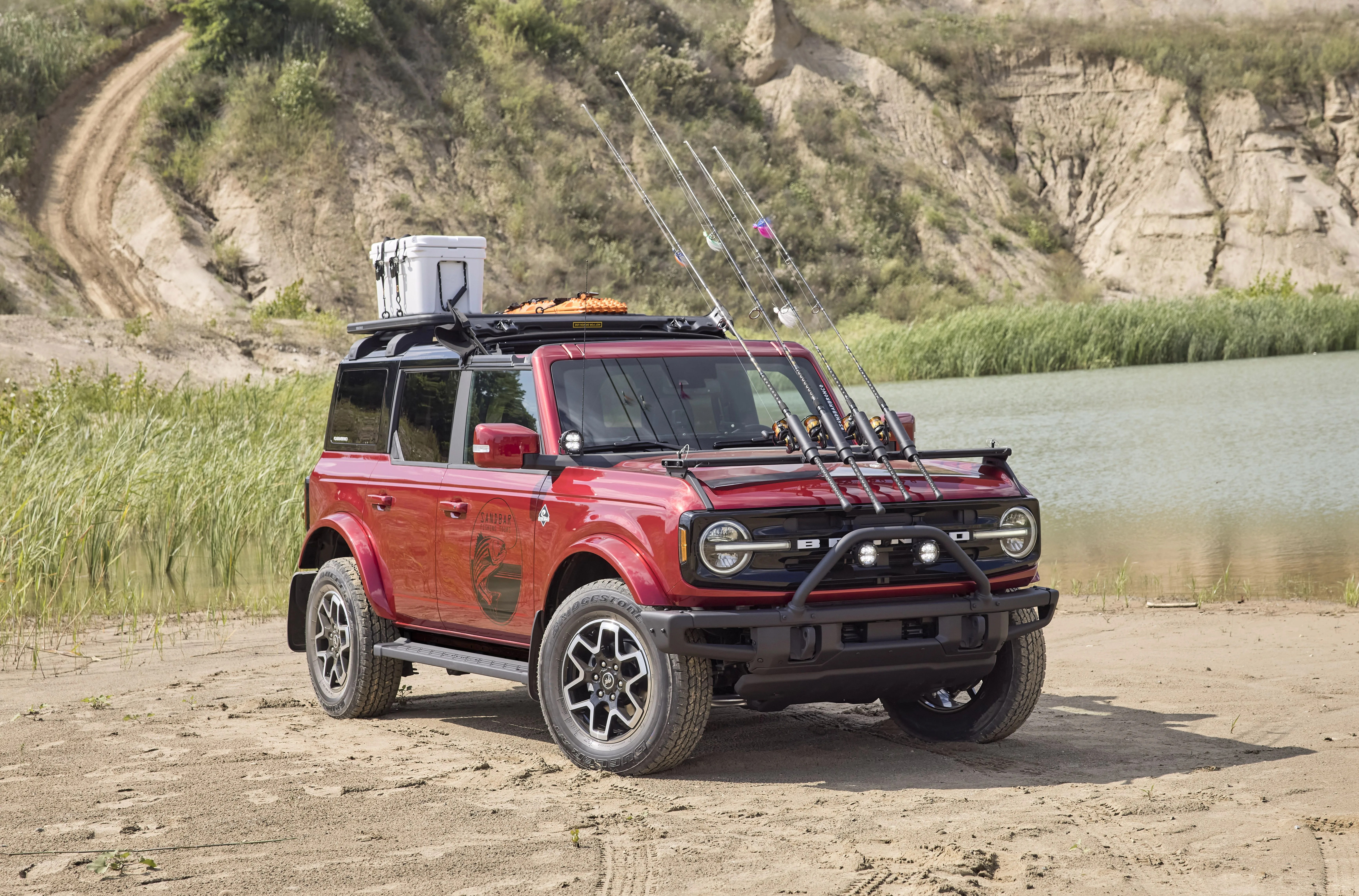bronco four door outer banks fishing guide purpose built to support a professional fishing guide along cape hatteras national seashore, this lifestyle concept is based off the regionally inspired four door bronco outer banks™ series on top is a bestop® sunrider® first row soft top, factory style concept roof rails and crossbars, and a yakima® locknload™ platform roof rack the suv makes use of fender mounted trail sights to fit a custom made fishing pole and seat perch to wait for the perfect catch a ford performance modular front bumper and safari bar help push through rugged terrain, while a slide out tailgate provides a great work surface when repairing fishing rods or stringing up new lures all weather floor mats and splash guards round out the package preproduction image with optional features shown available beginning spring 2021 available late 2021