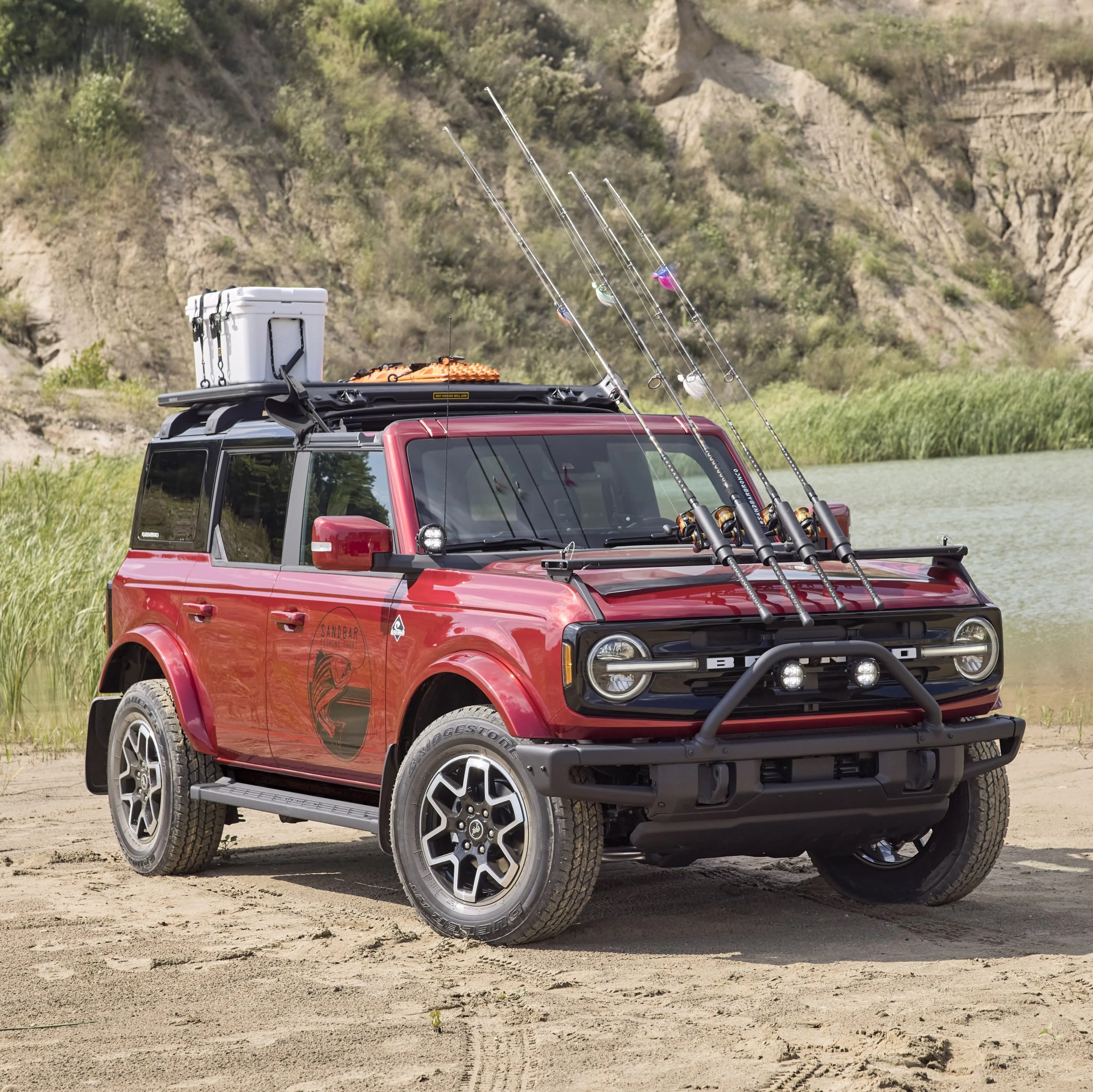 bronco four door outer banks fishing guide purpose built to support a professional fishing guide along cape hatteras national seashore, this lifestyle concept is based off the regionally inspired four door bronco outer banks™ series on top is a bestop® sunrider® first row soft top, factory style concept roof rails and crossbars, and a yakima® locknload™ platform roof rack the suv makes use of fender mounted trail sights to fit a custom made fishing pole and seat perch to wait for the perfect catch a ford performance modular front bumper and safari bar help push through rugged terrain, while a slide out tailgate provides a great work surface when repairing fishing rods or stringing up new lures all weather floor mats and splash guards round out the package preproduction image with optional features shown available beginning spring 2021 available late 2021