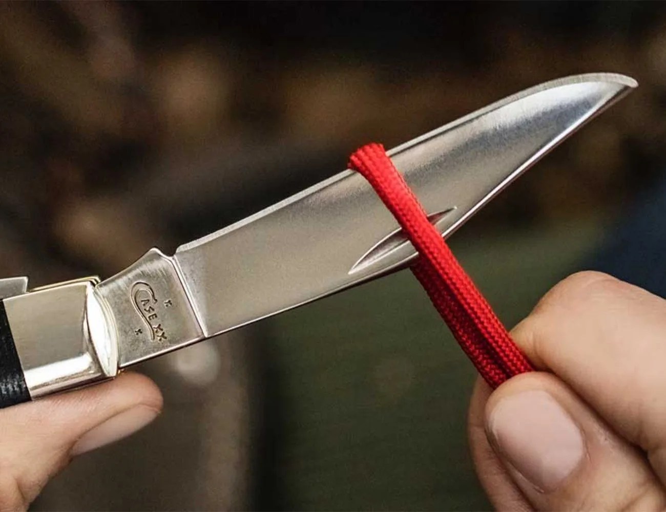 case knife cutting a cord