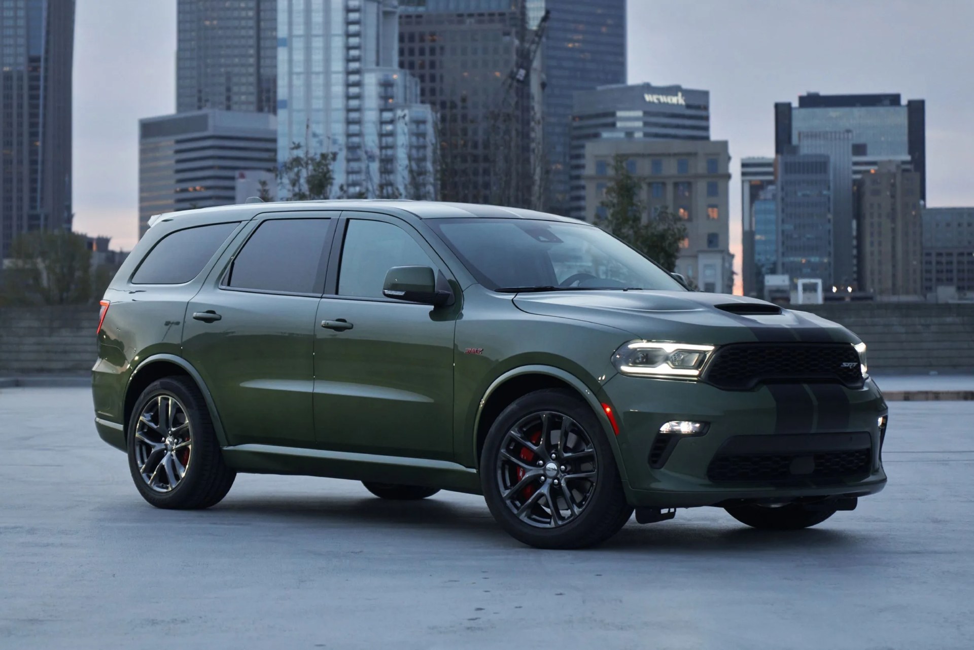 2021 dodge durango srt 392 equipped with the 392 cubic inch hemi v 8 delivering 475 horsepower and 470 lb ft of torque, the durango srt 392 features new aggressive exterior styling and a new interior with a driver centric cockpit, shown here in f8 green with dual low gloss gunmetal stripes