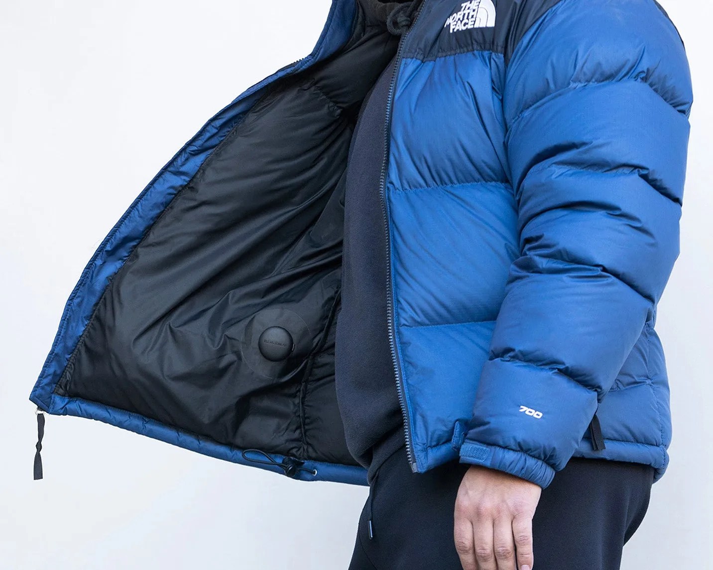 airtag mounted to the inside of a jacket