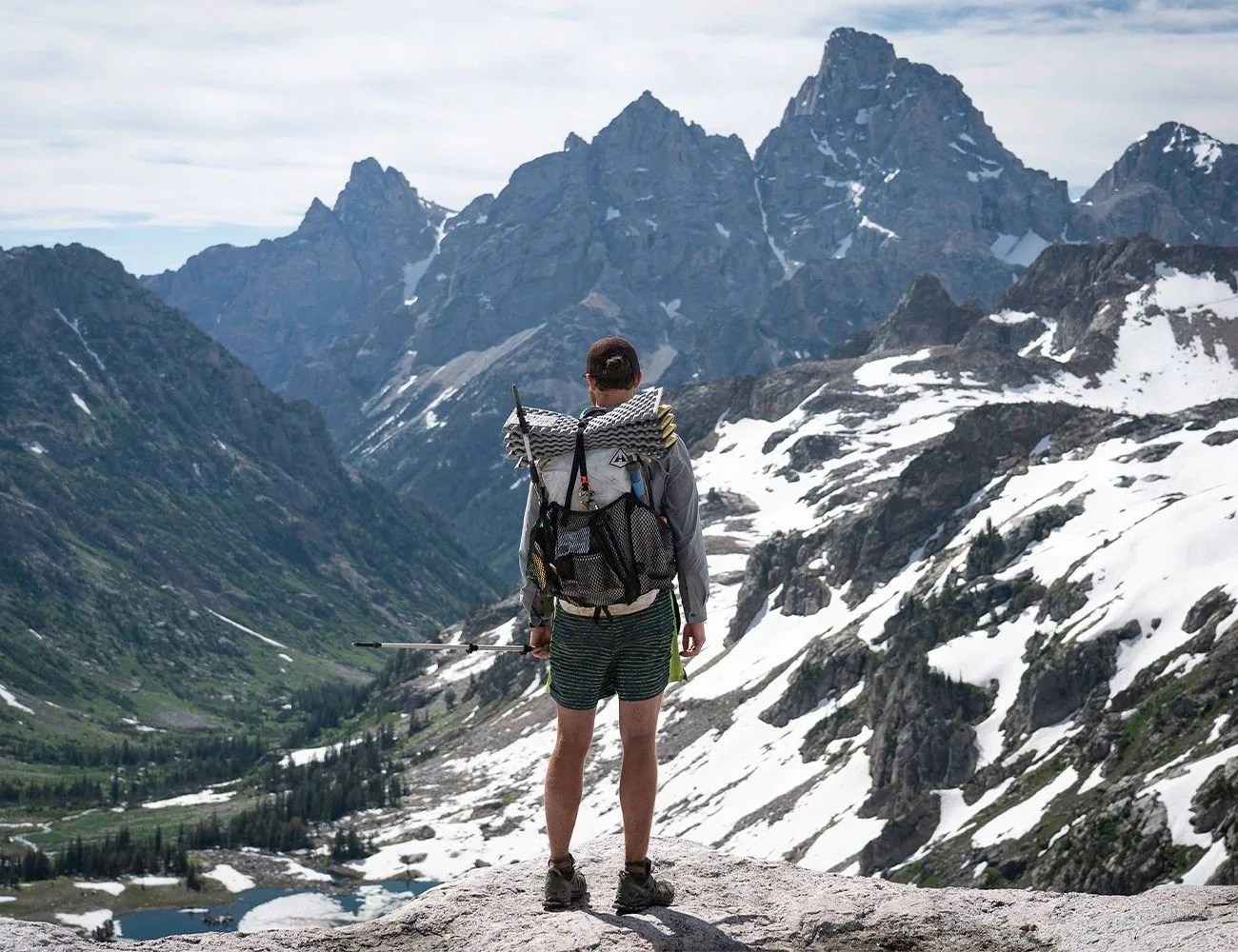 man on a mountain wearing hyperlite mountain gear backpack