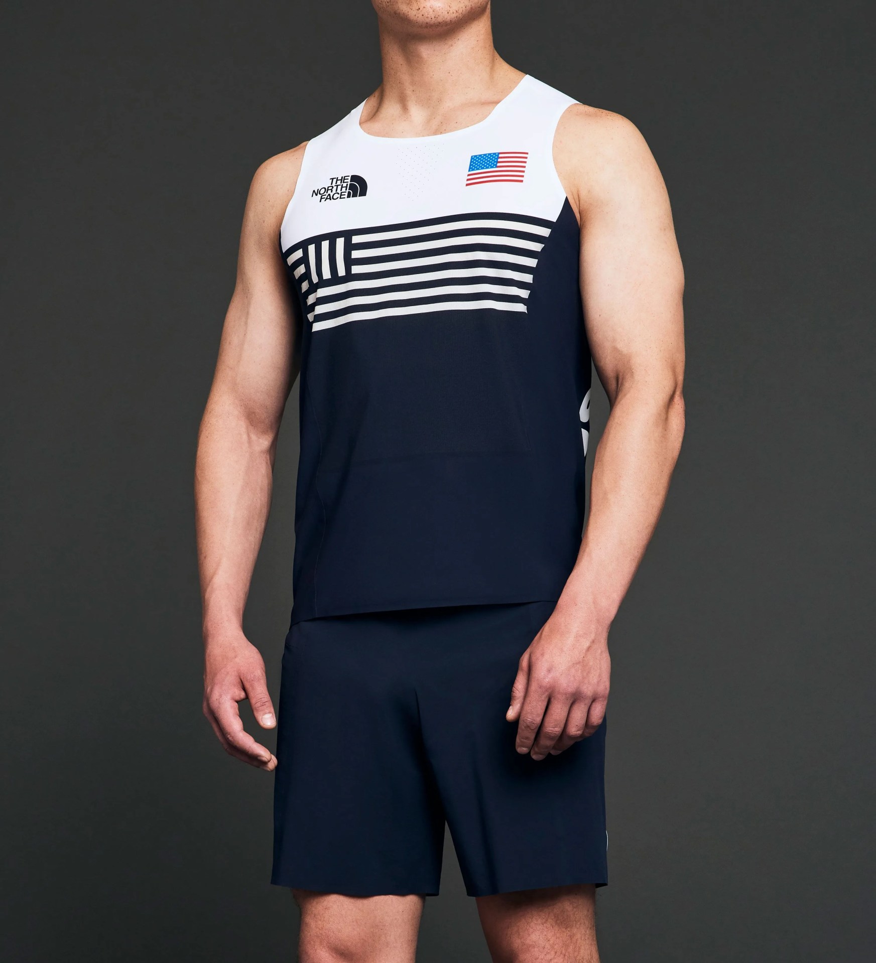 a man wearing an olympic climbing uniform