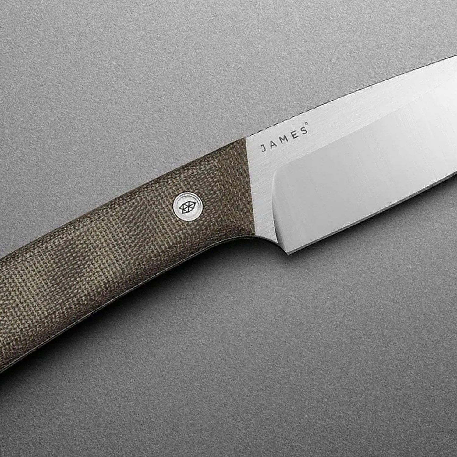 a fixed blade knife with a green handle