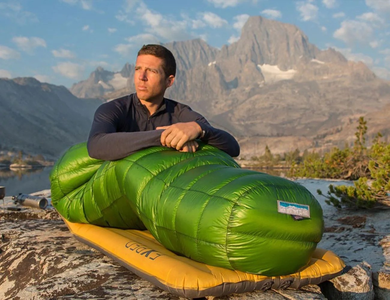 man sitting up in a sleeping bag