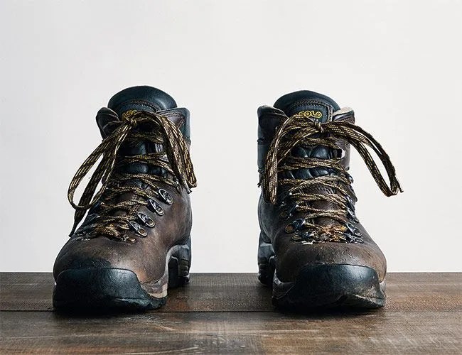 a pair of brown leather hiking boots