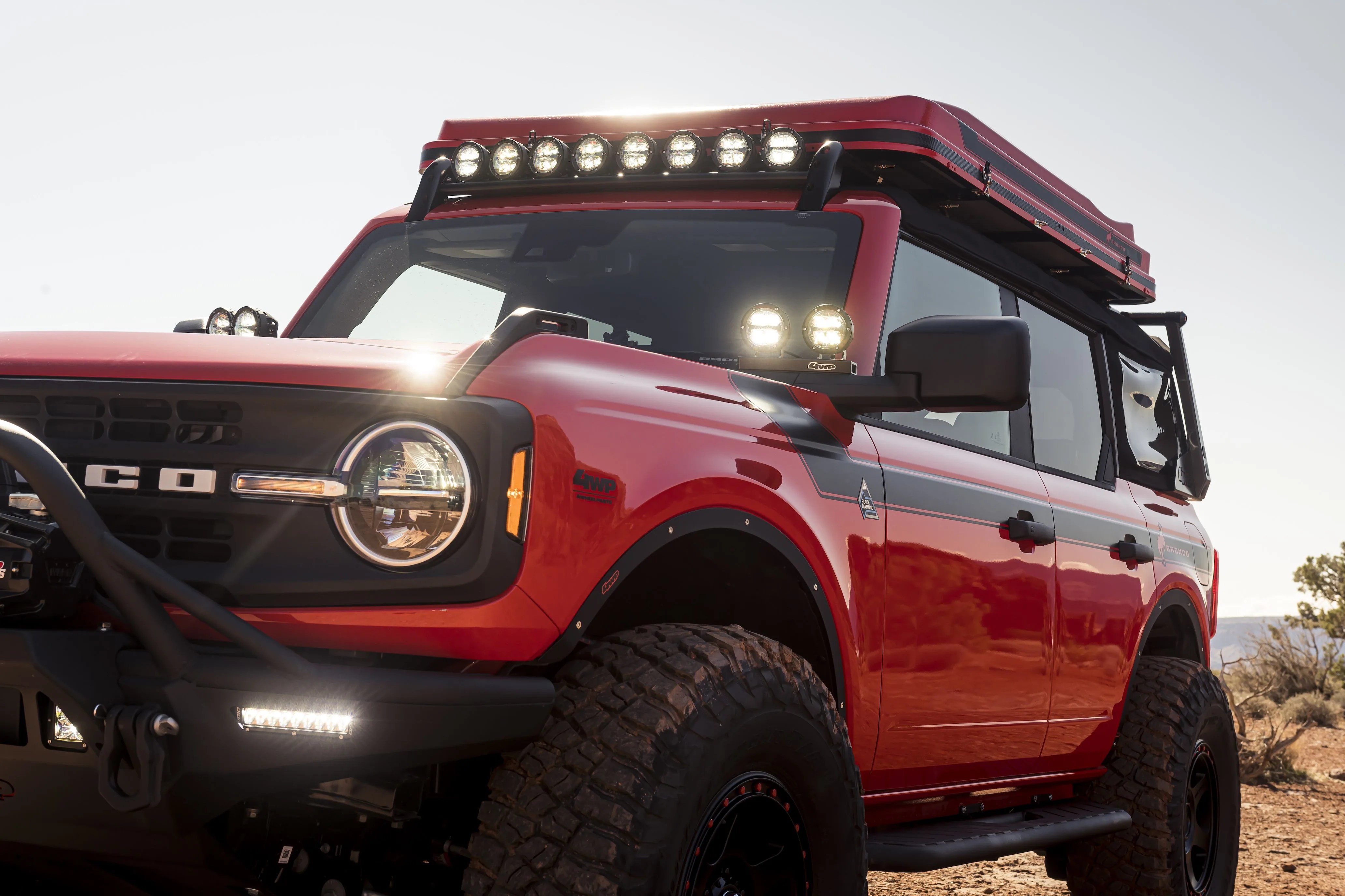 high performance off road parts designed by arb specifically for bronco two  and four door are featured in this custom bronco badlands four door suv including airbag compliant front and rear bumpers, heavy duty rock sliders and differential cover, plus essential off road accessories like an arb twin compressor, jack and zero refrigeratorfreezer