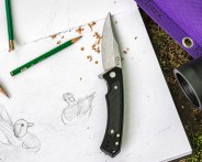 a knife on a piece of paper