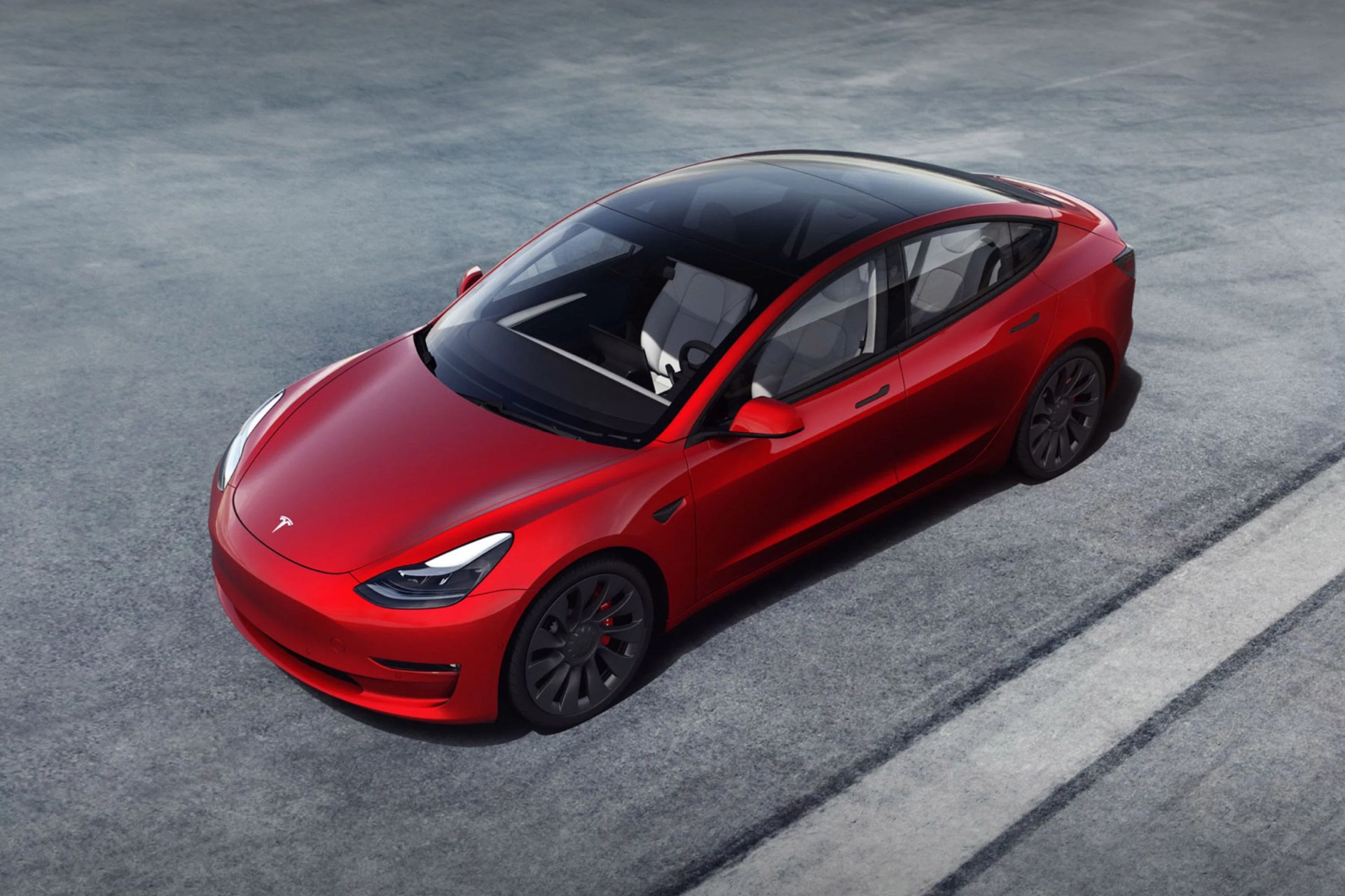 tesla model 3 red car