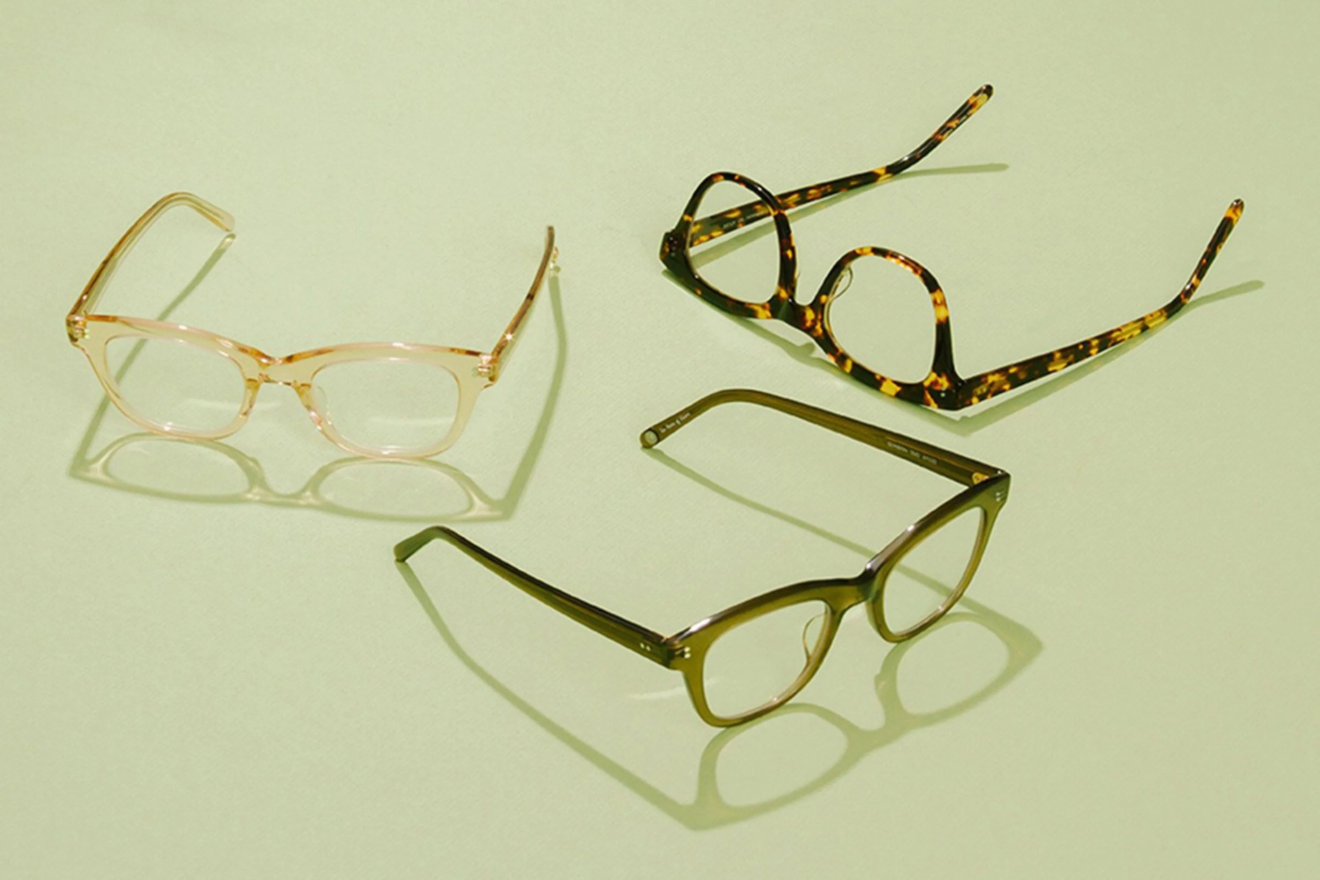 glasses on green background