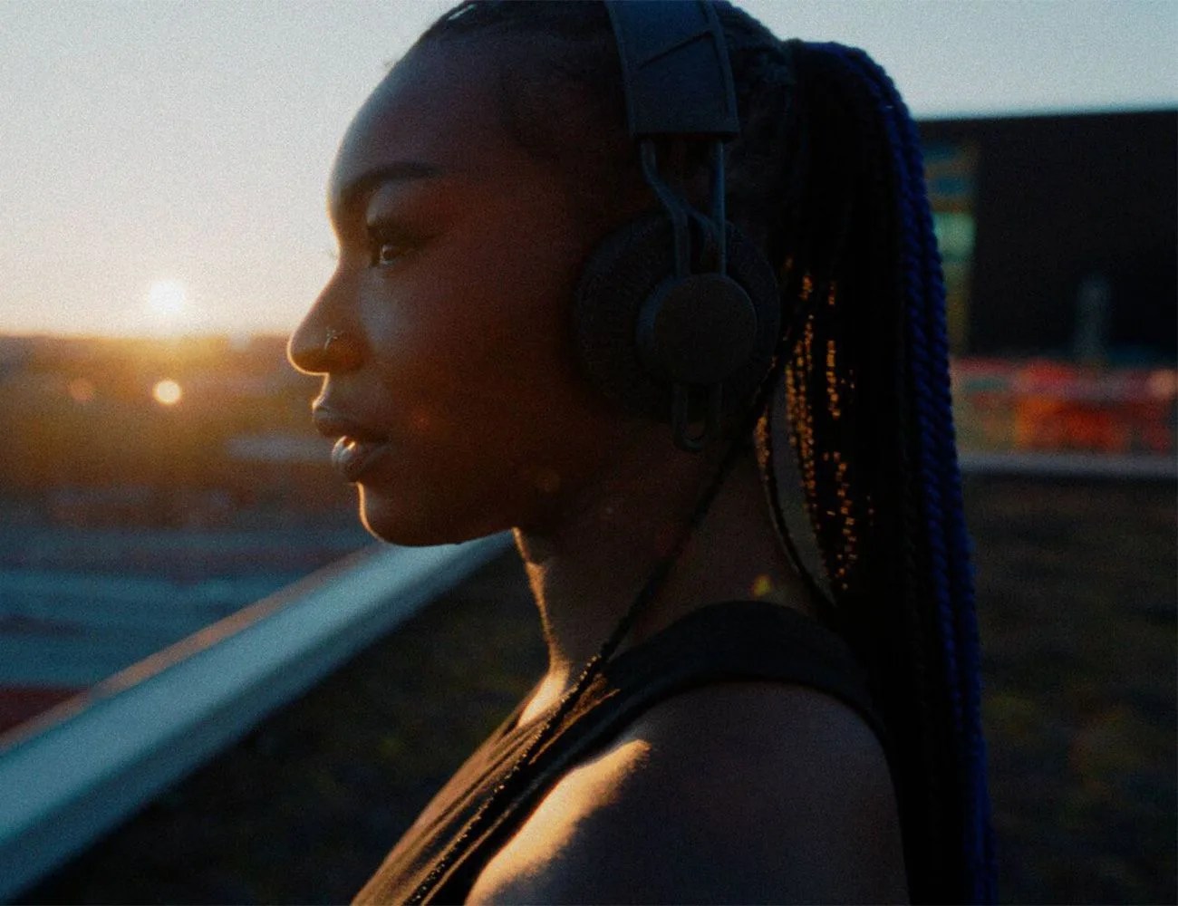 woman wearing adidas rpt 02 sol headphones