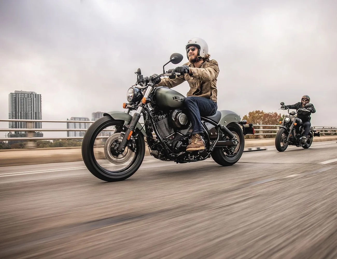 two people riding on a 2022 chief dark horse motorcycle