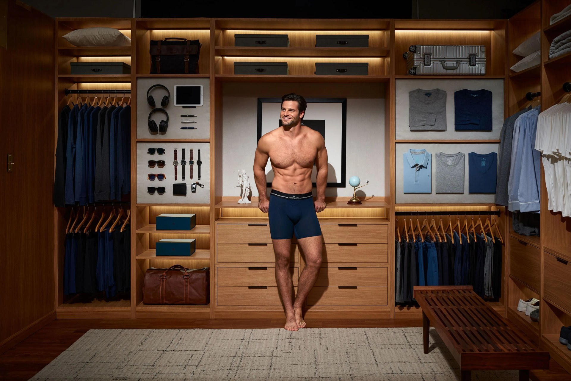 man wearing tommy john boxers standing in walk in closet