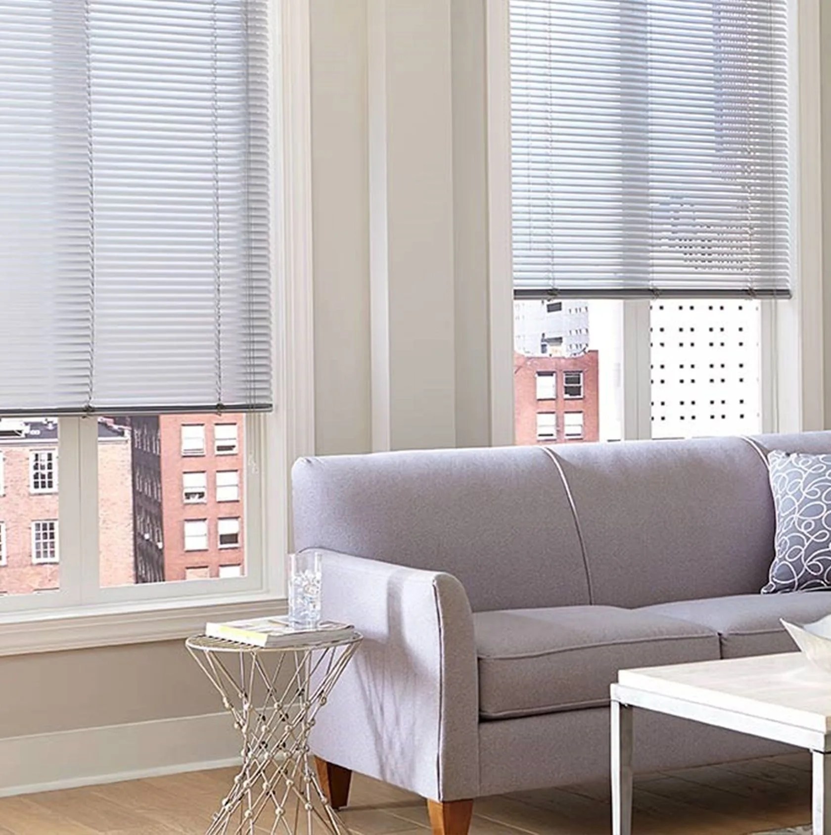 home depot living room with window shades and a purple sofa