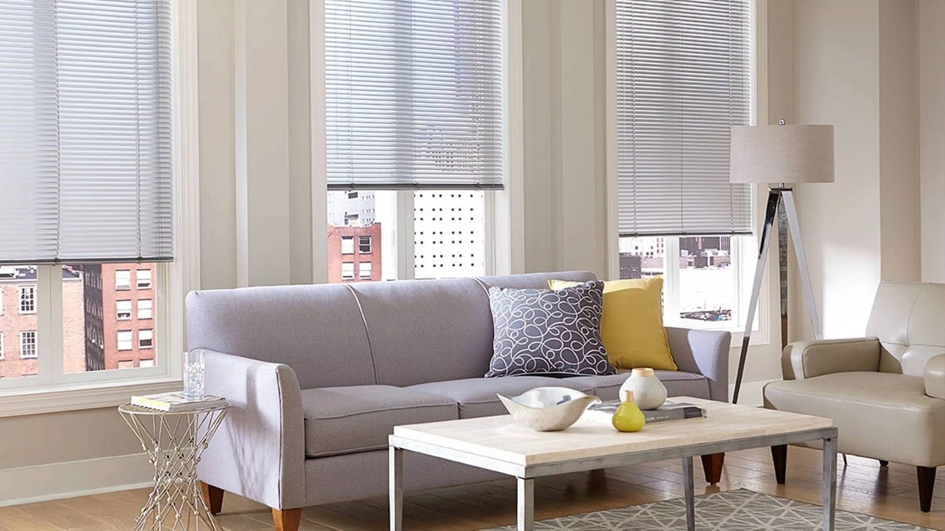 home depot living room with window shades and a purple sofa