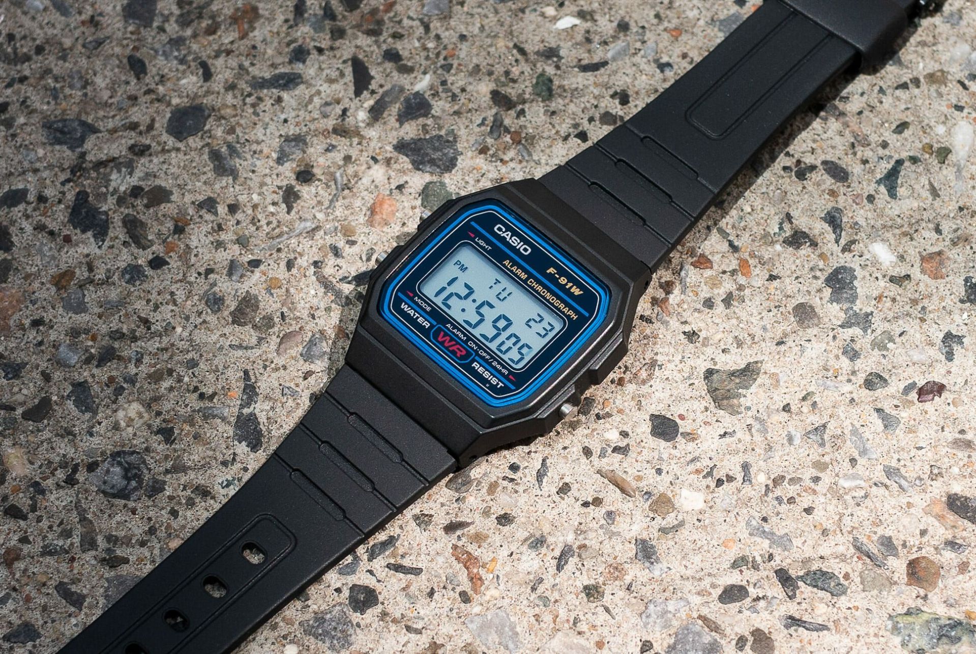 a casio watch on a stone surface