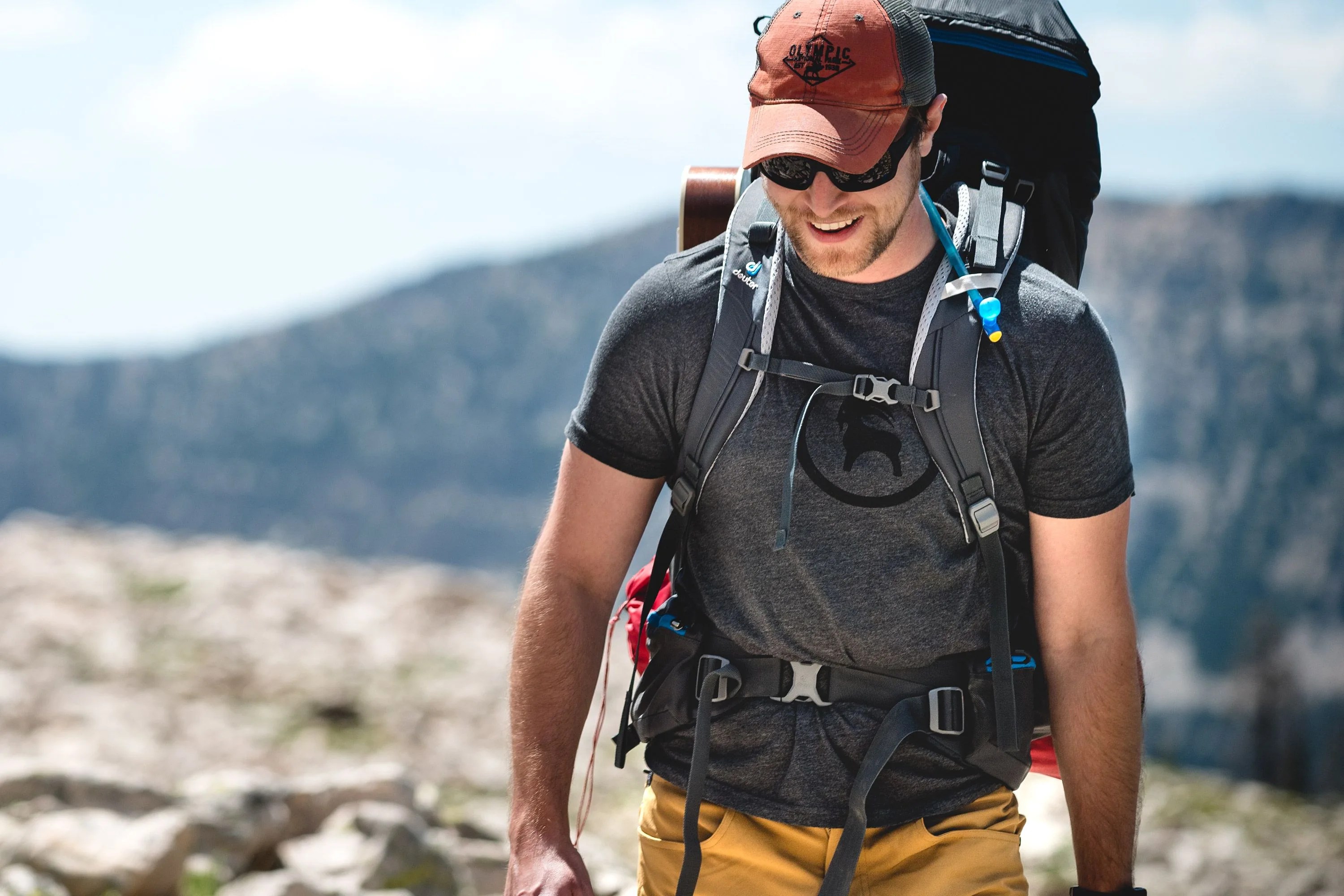 man hiking wearing backcountry gear