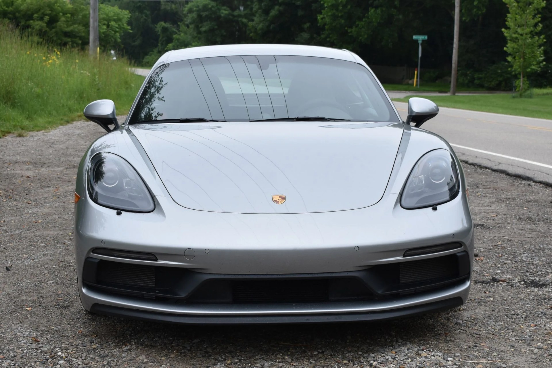 silver porsche cayman gts 4 front