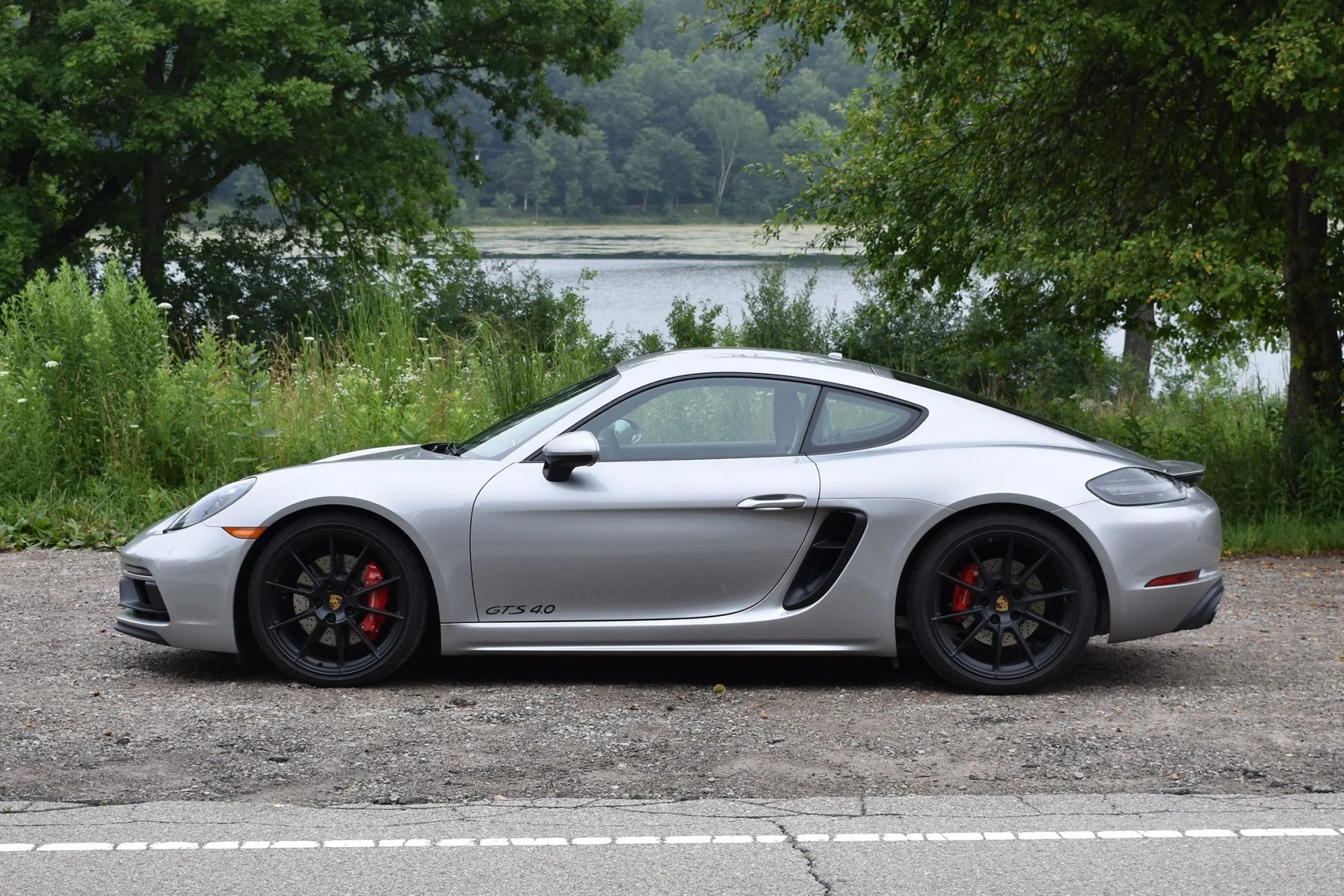 silver porsche cayman gts 4 side