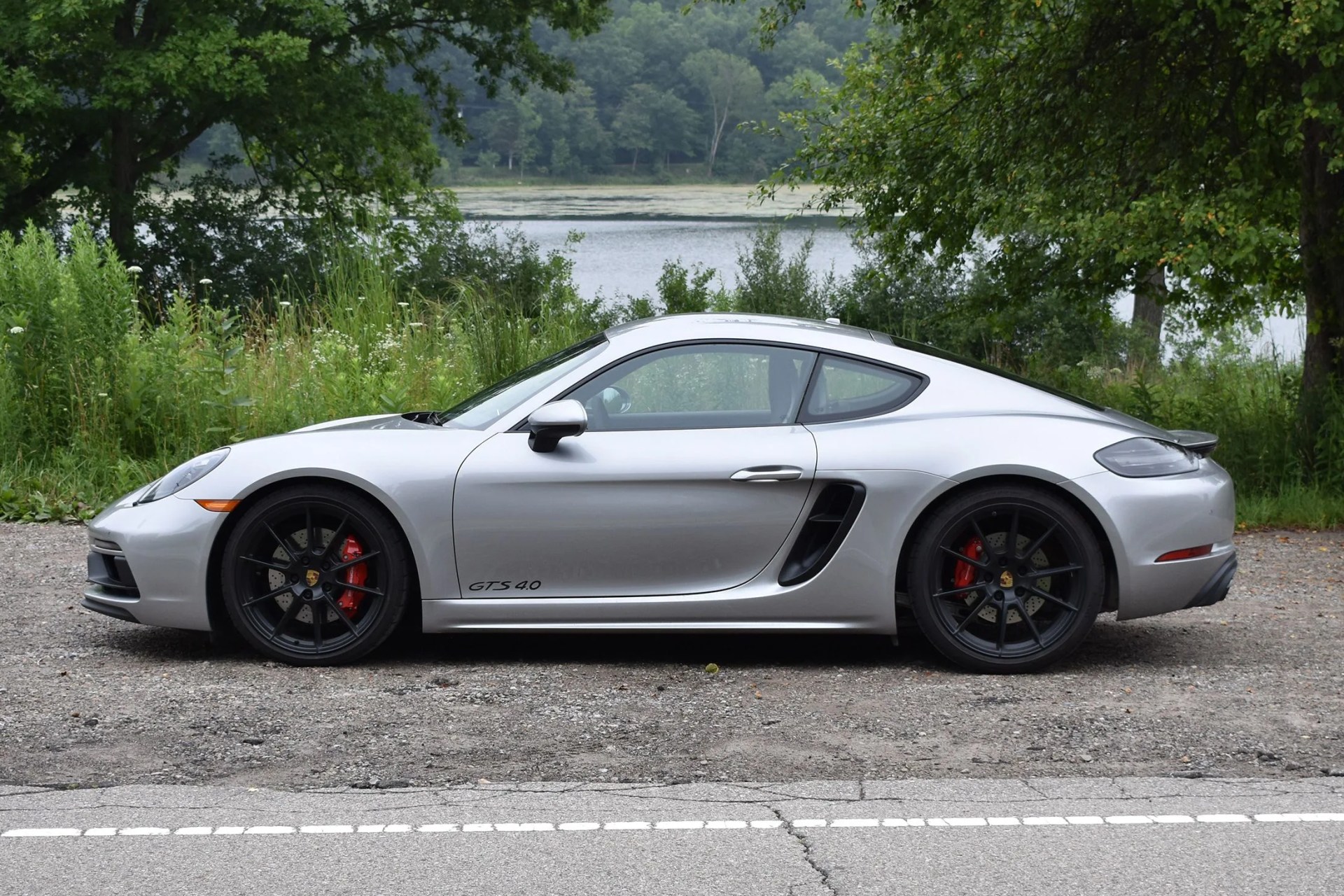 silver porsche cayman gts 4 side