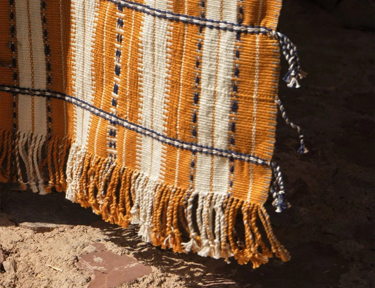 yellow rug hanging