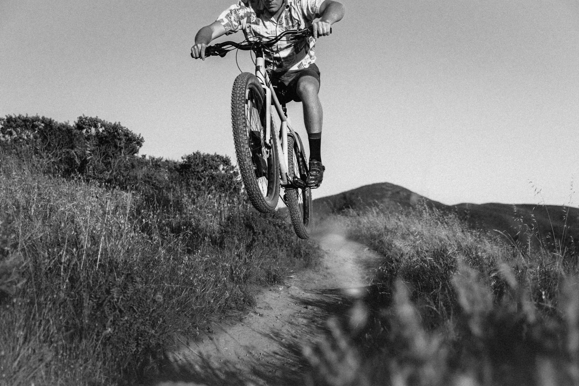 man biking on hill