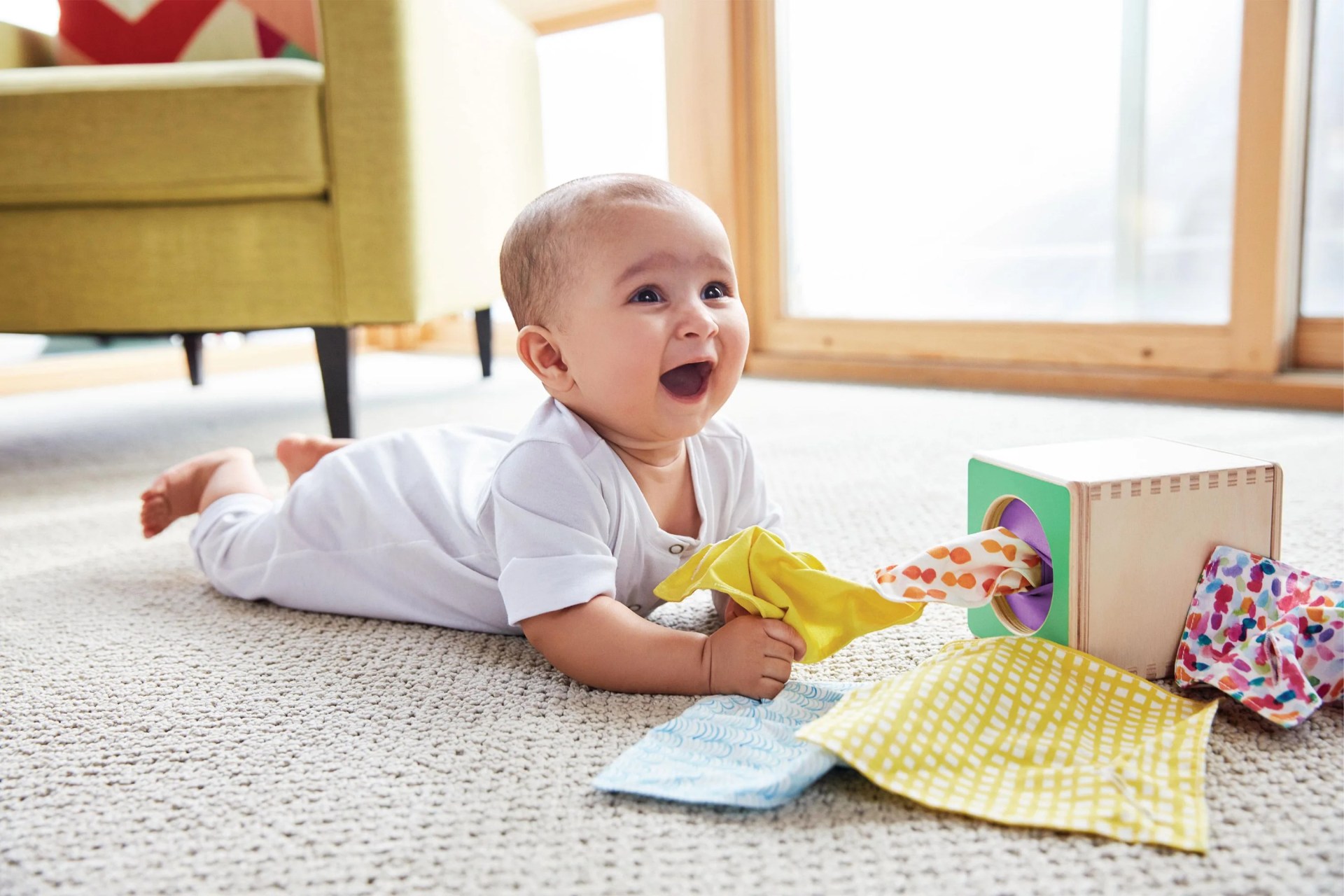 baby playing with lovevery set