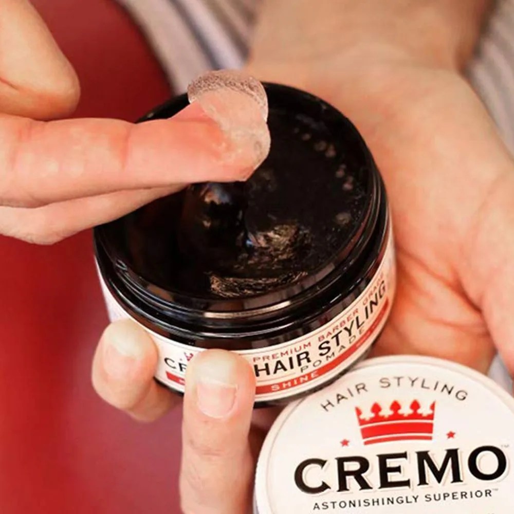 person using cremo pomade