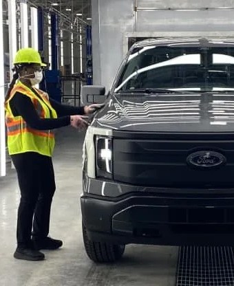 person working on new ford