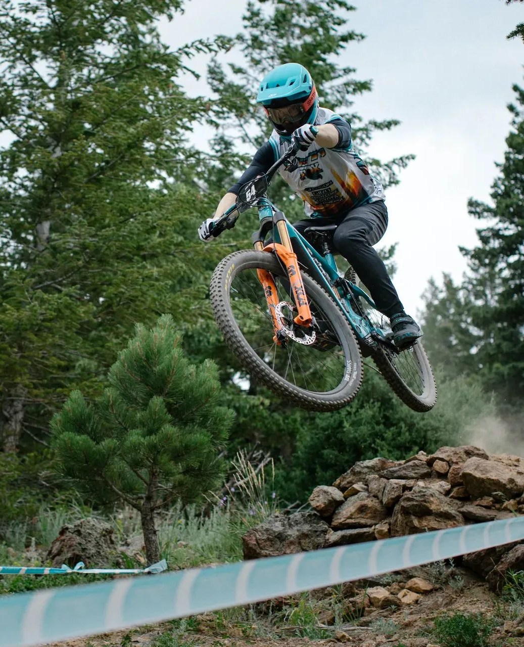 person riding 160e yeti bike