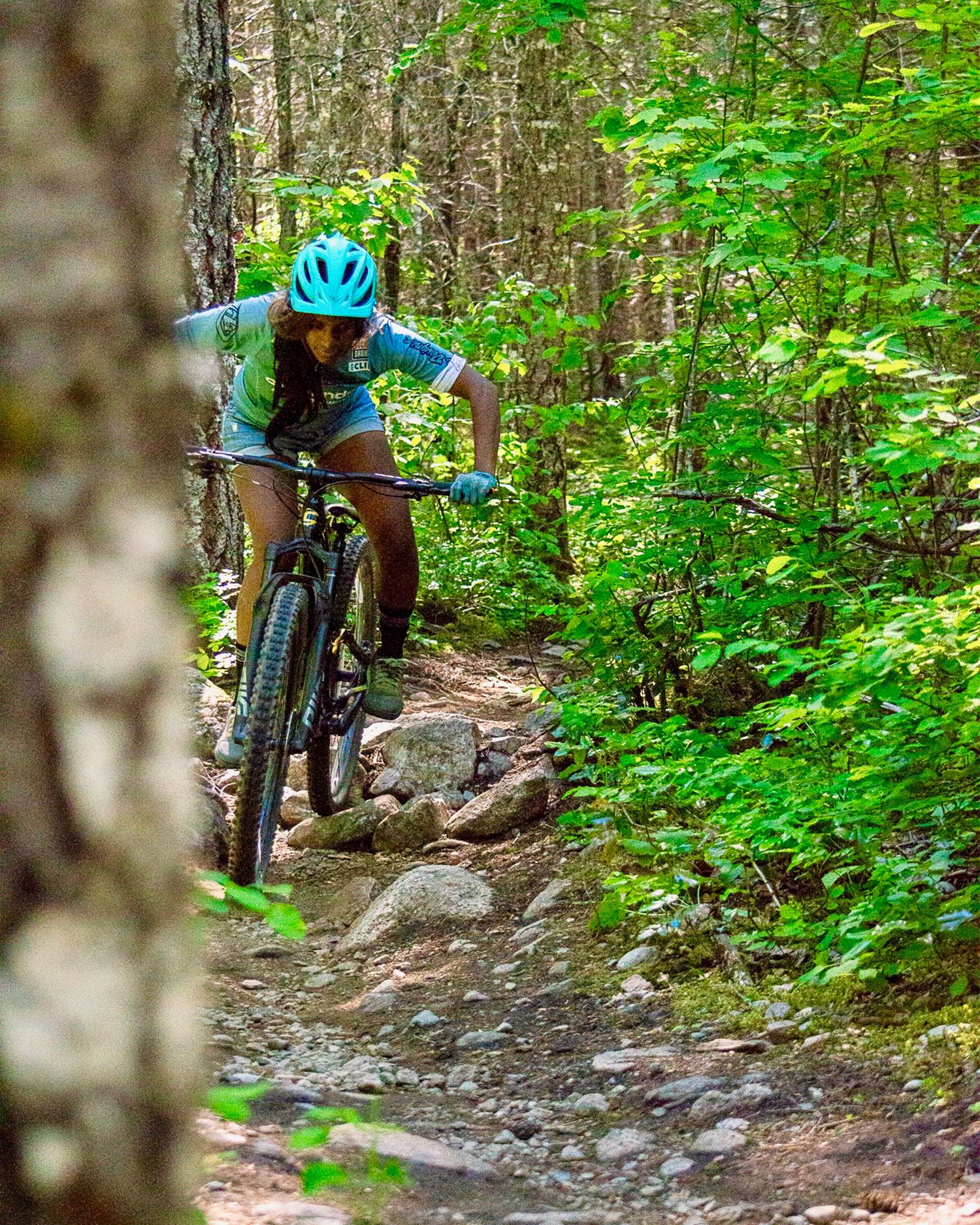 anita naidu riding a bike downhill