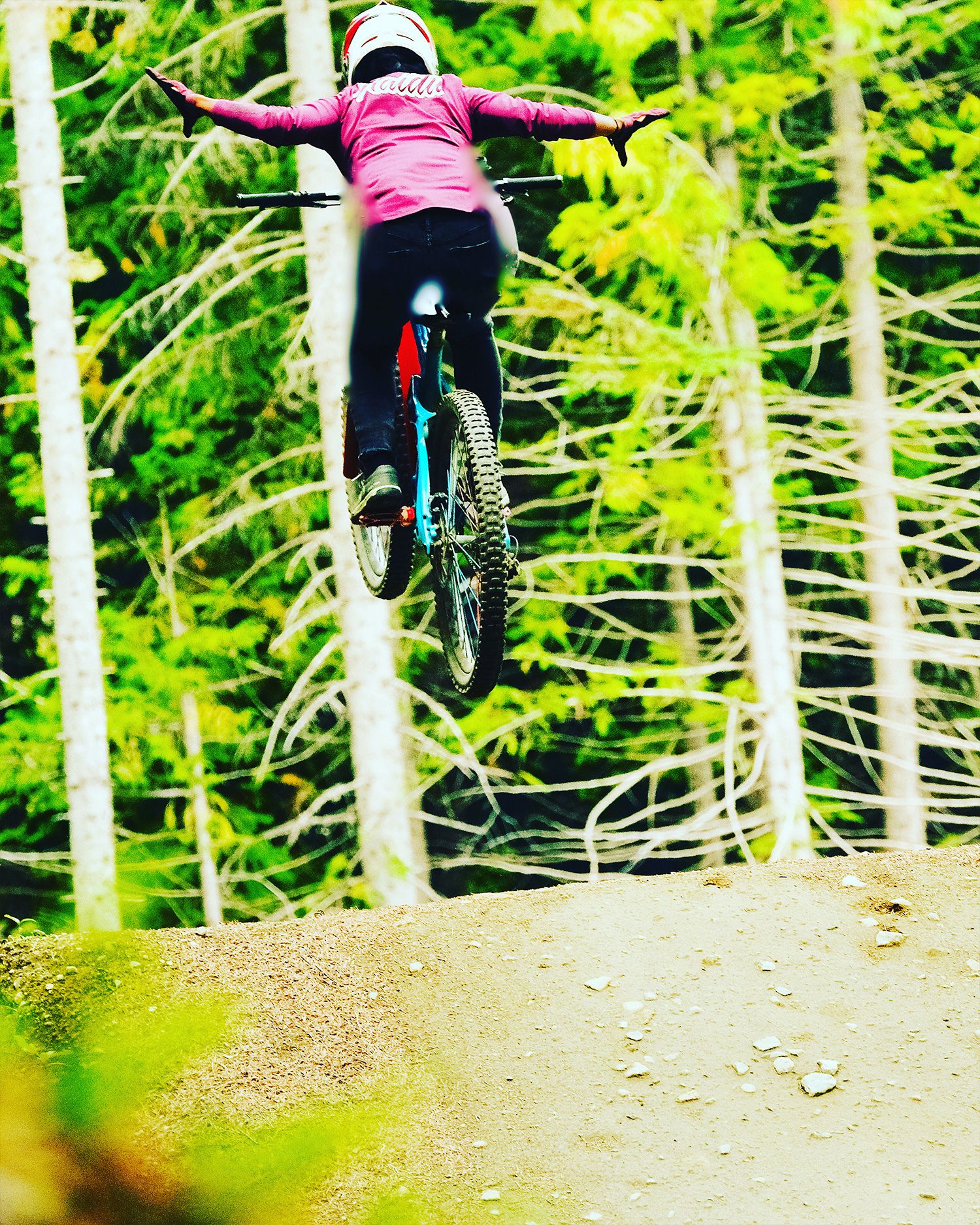 anita naidu catching air on her bike