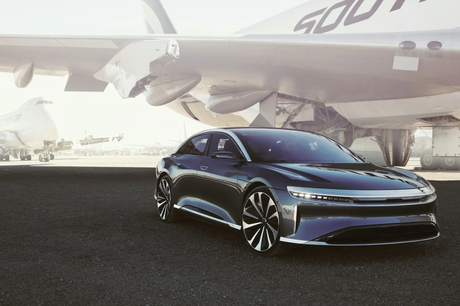 lucid motors air ev with plane