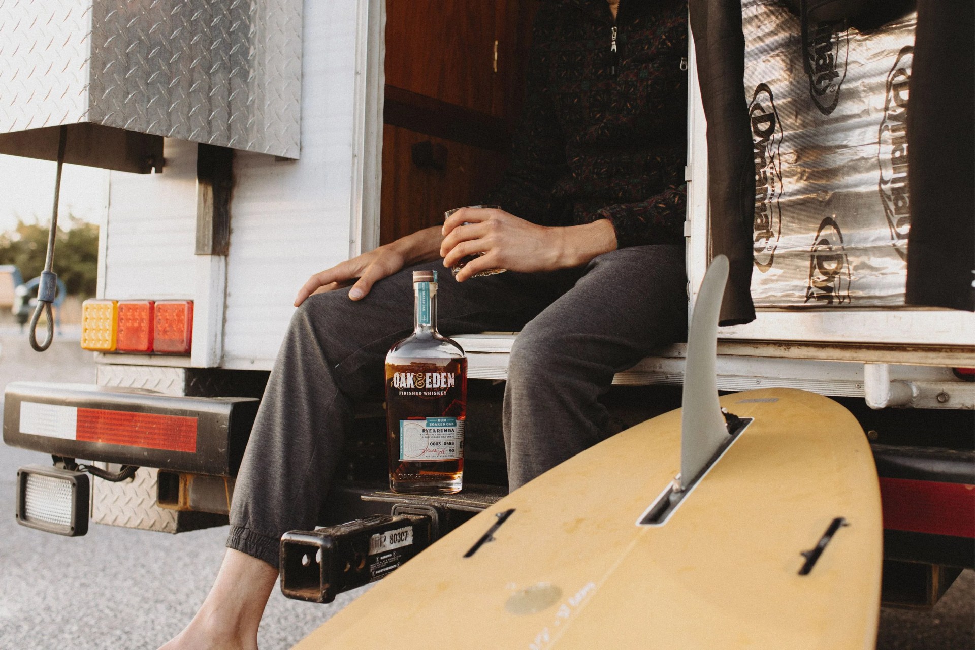 man sitting with a glass of oak and eden