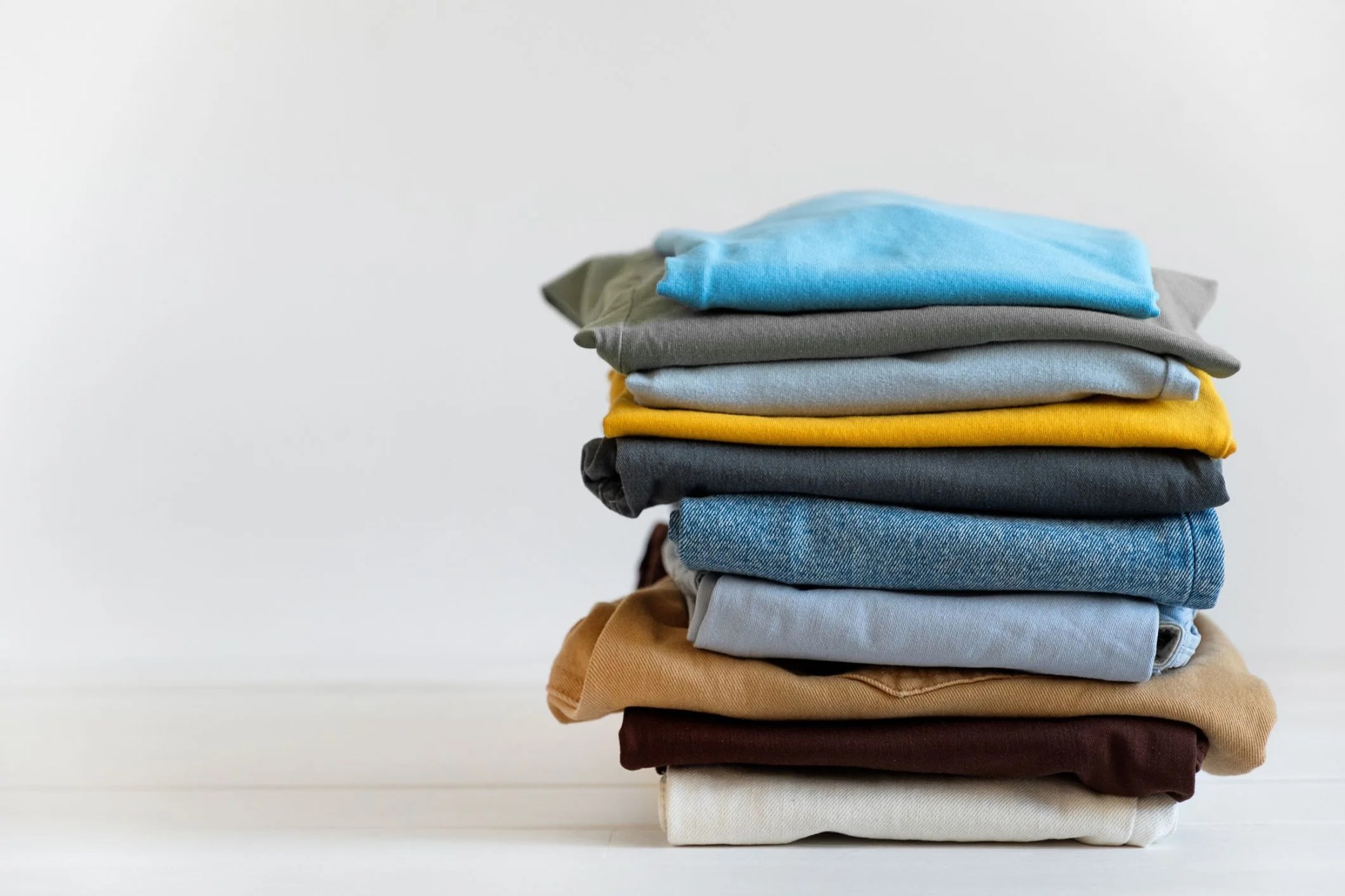 a stack of folded clothing