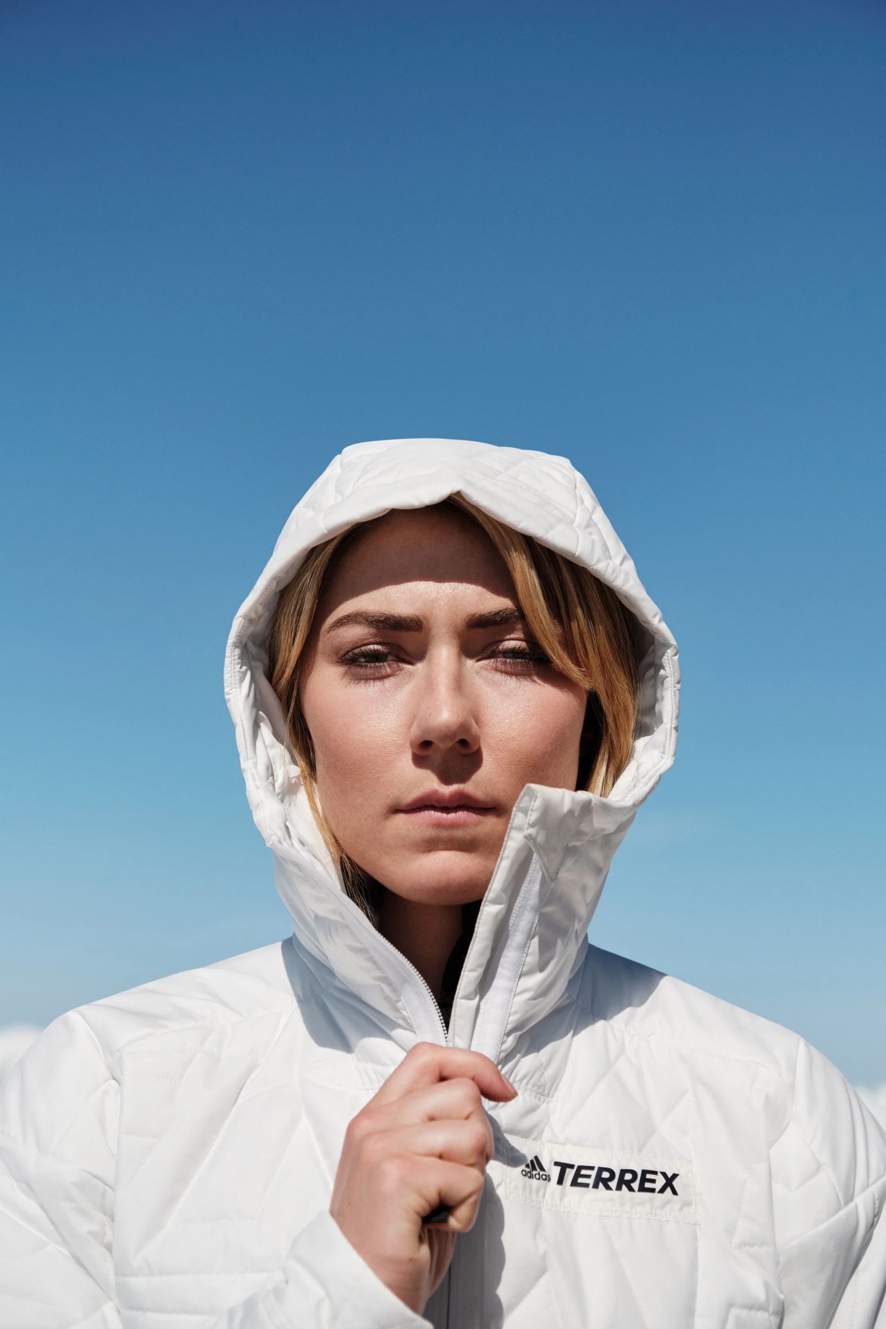 woman zipping up her terrex jacket