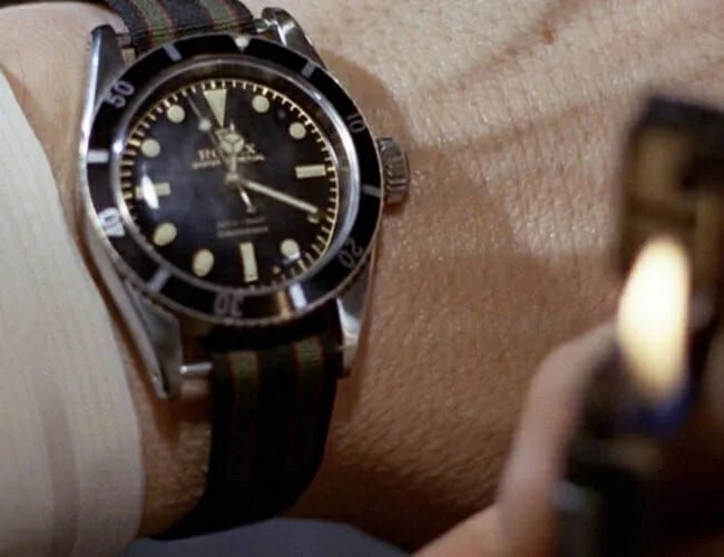 james bond in goldfinger wearing rolex on a fabric strap