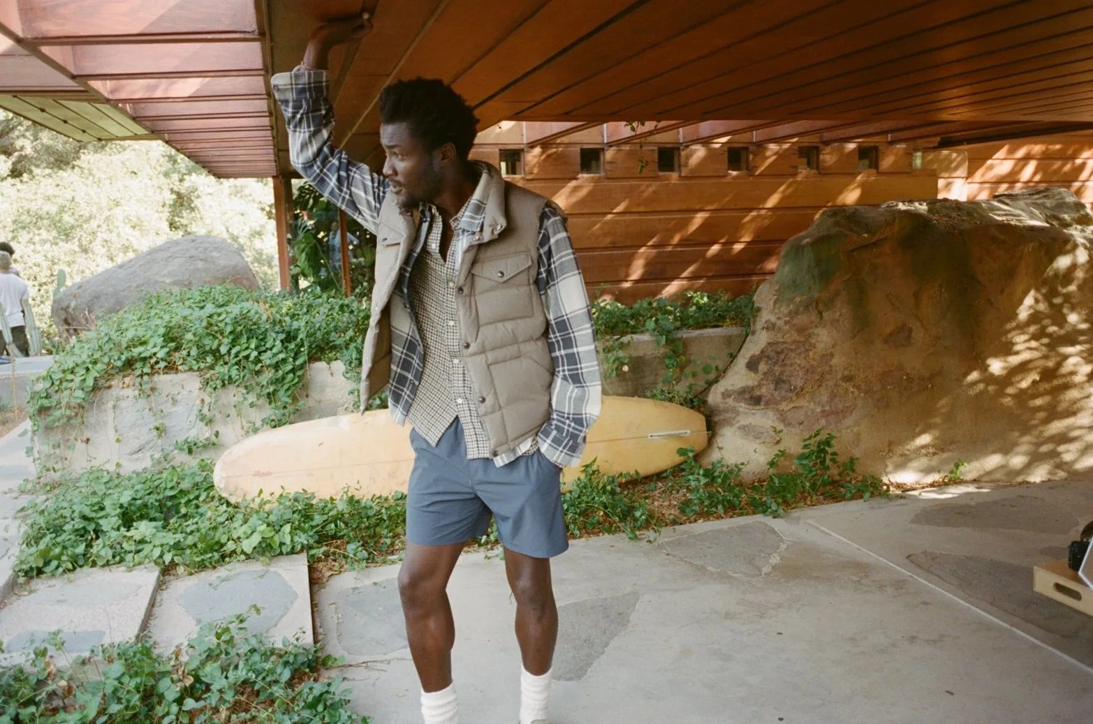 man wearing buck mason vest
