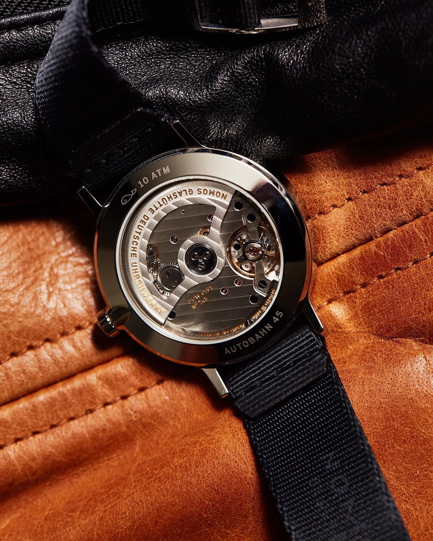 nomos watch back