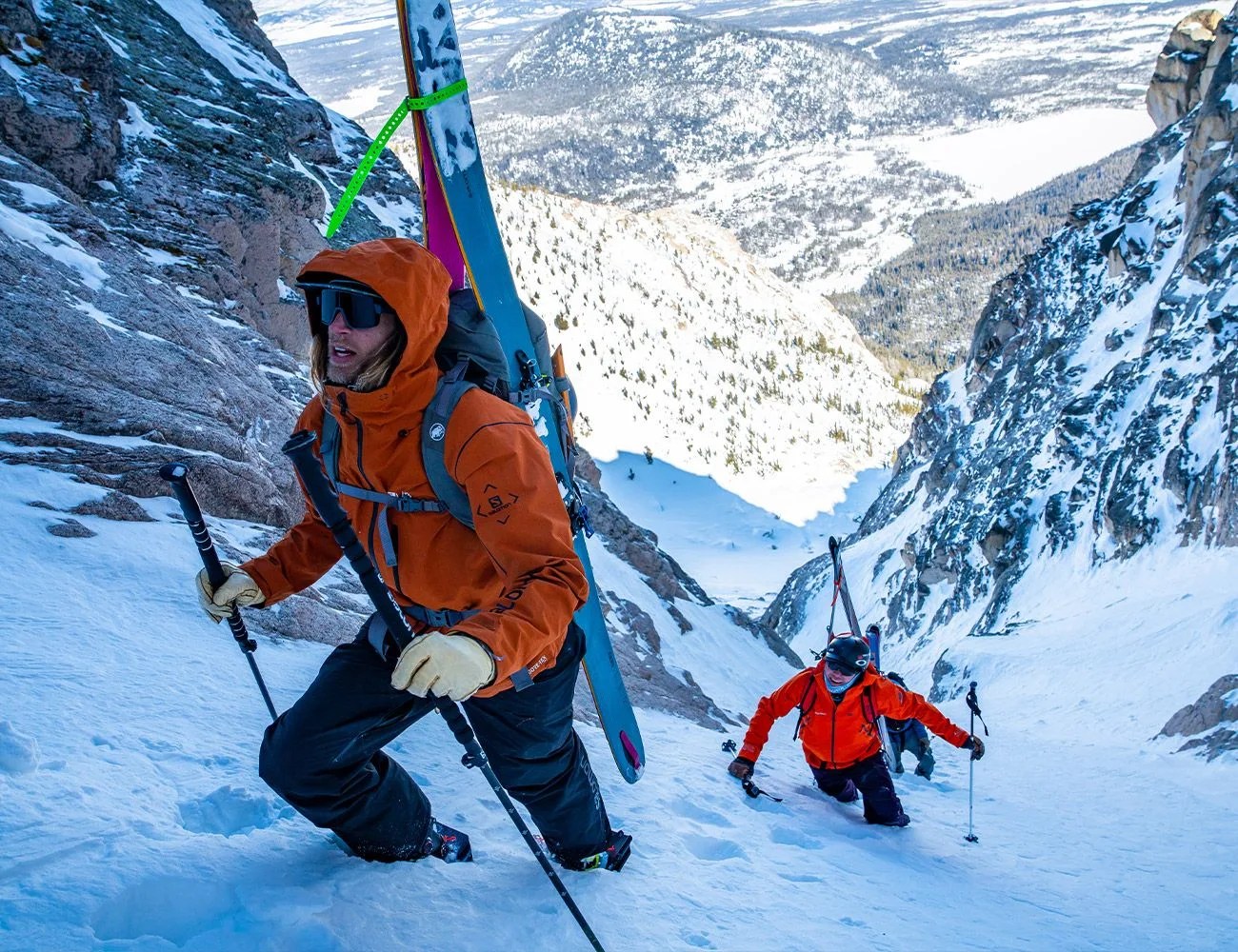 men hiking up mountainside