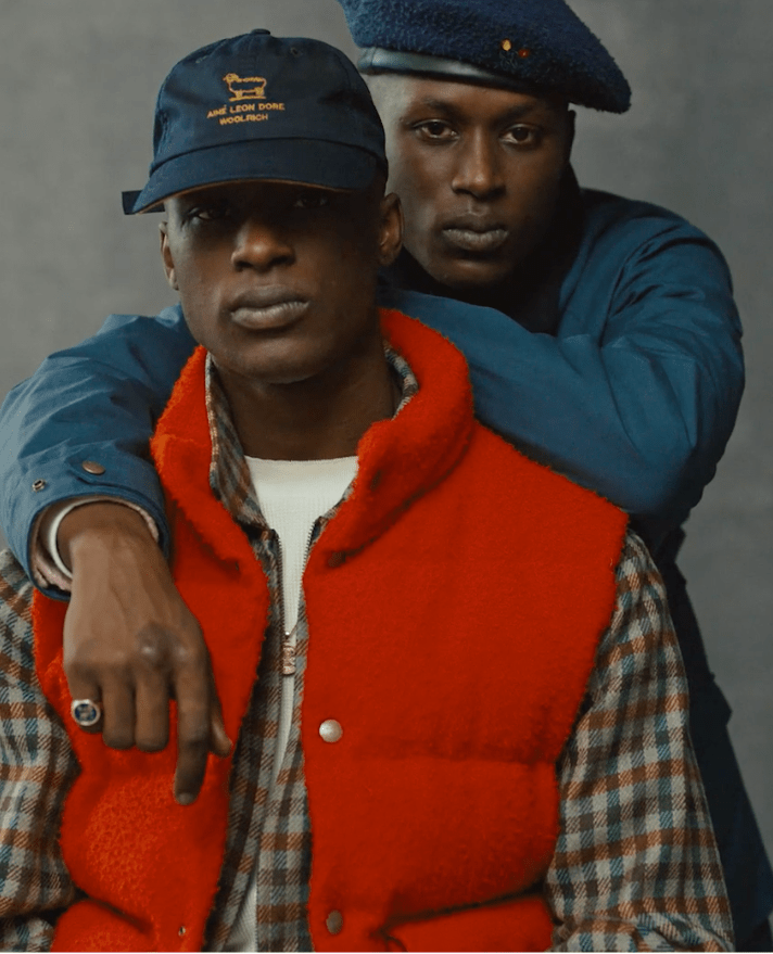 man leaning over another man's shoulder