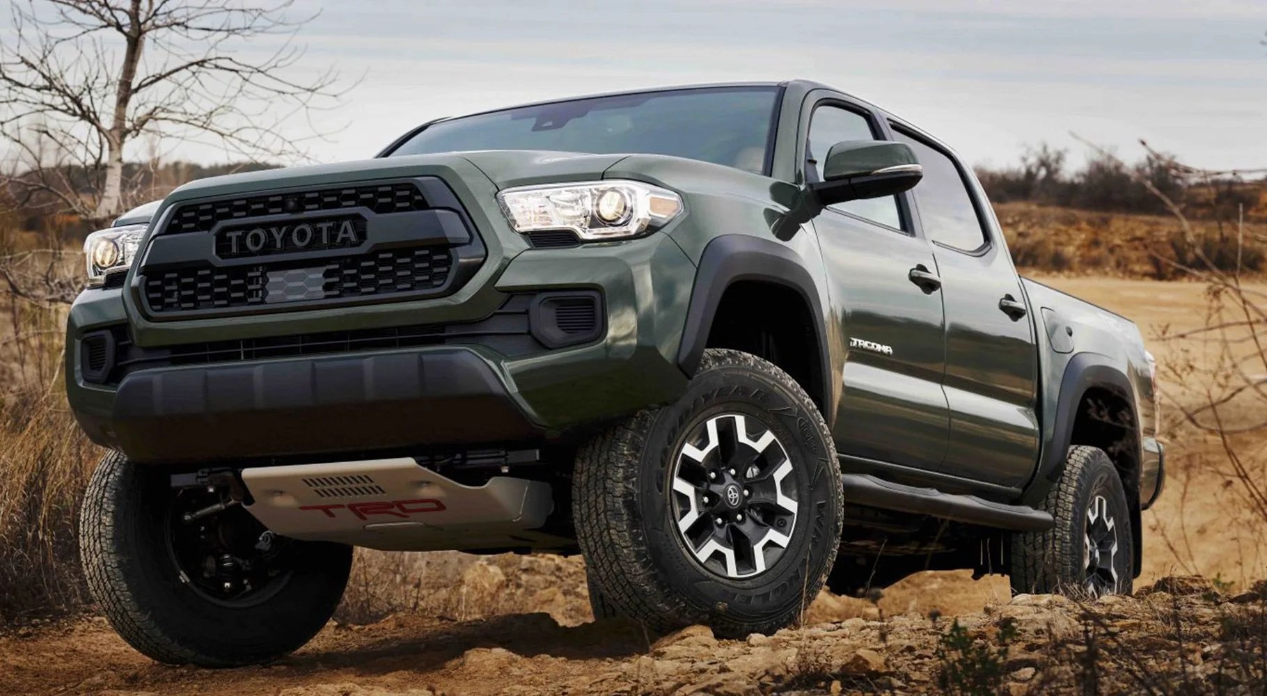 toyota tacoma coming over a crest