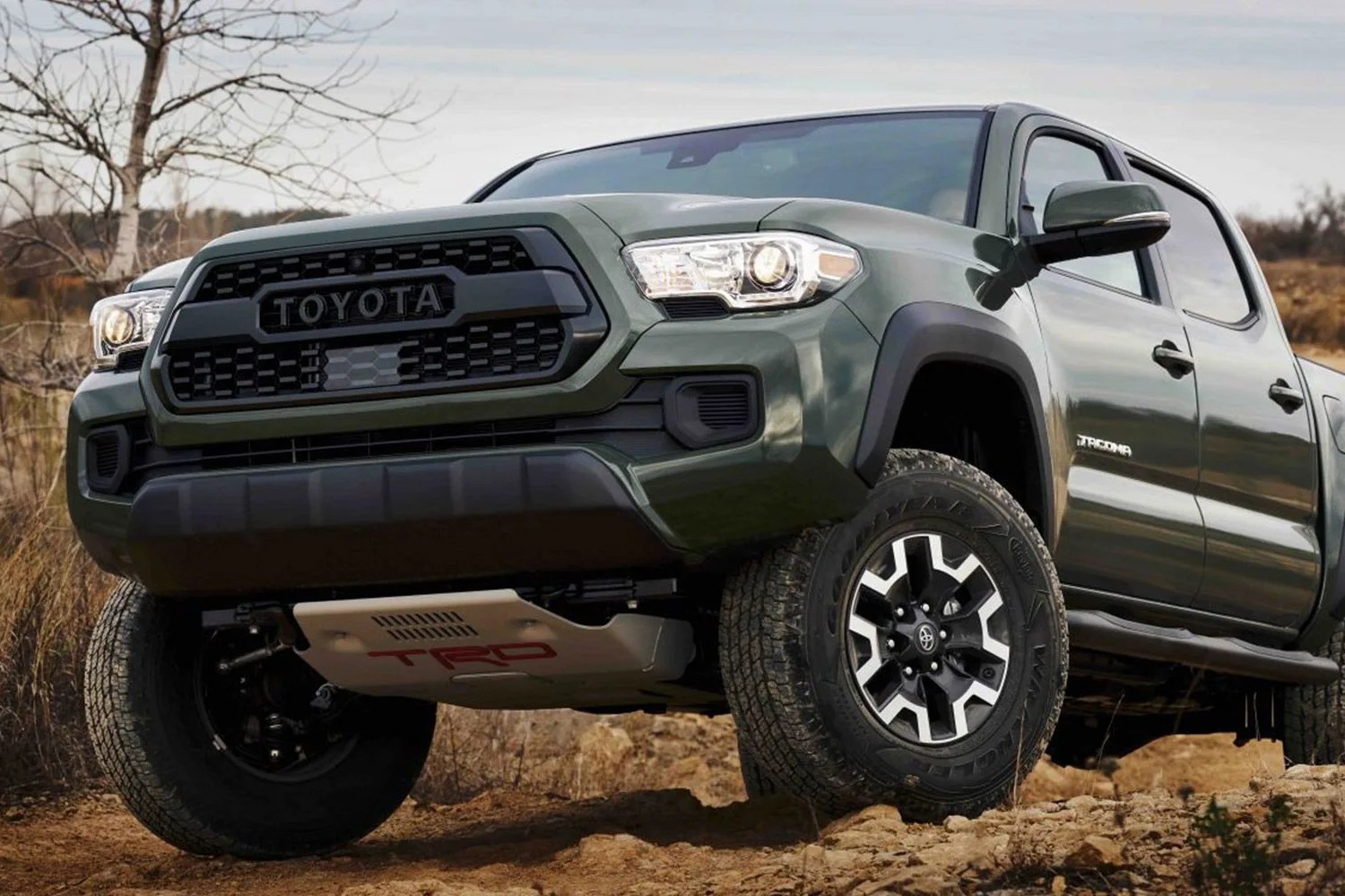 toyota tacoma coming over a crest