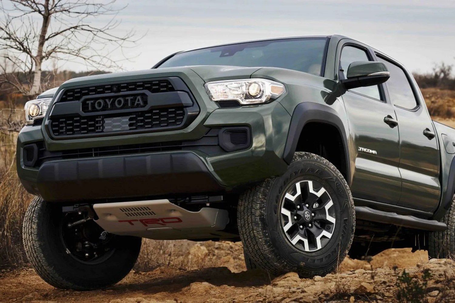 toyota tacoma coming over a crest