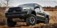 toyota tacoma coming over a crest