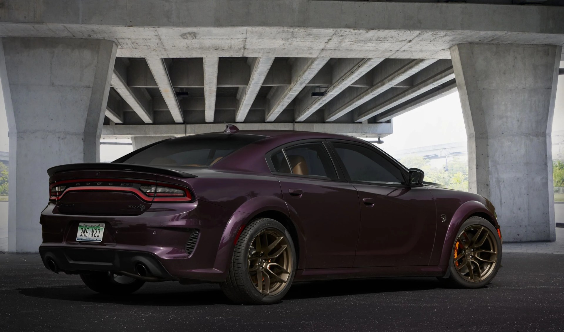 the “brass funky” order combination for the 2022 dodge charger srt hellcat redeye widebody jailbreak model combines a hellraisin exterior with sepia laguna leather seats, sepia floor mats, carbon fiber bezels, suede headliner, alcantara steering wheel with a white srt logo on the interior and much more that can be customized