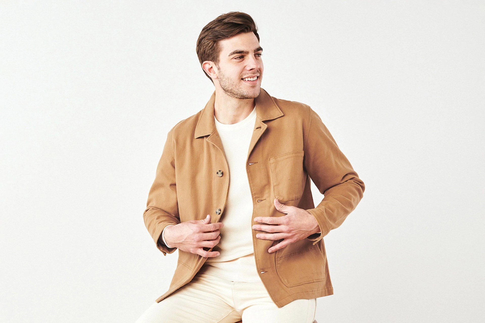 man wearing quince chore jacket in tobacco