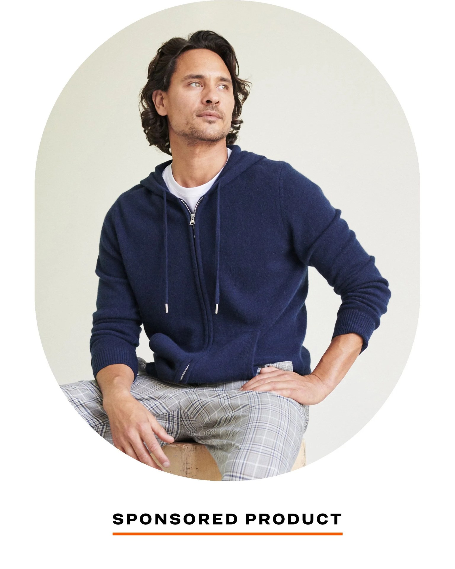 man wearing blue quince hoodie