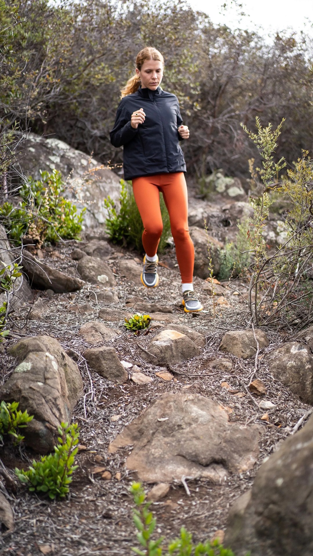 woman running down hill