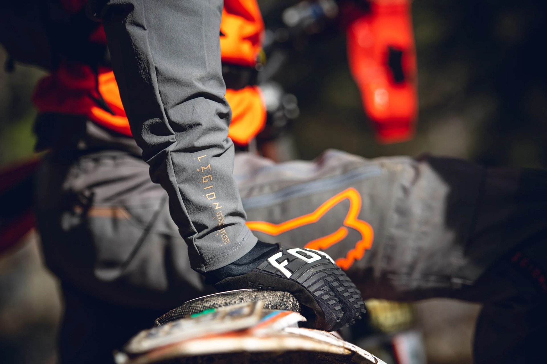 person on motorcycle wearing fox racing gear